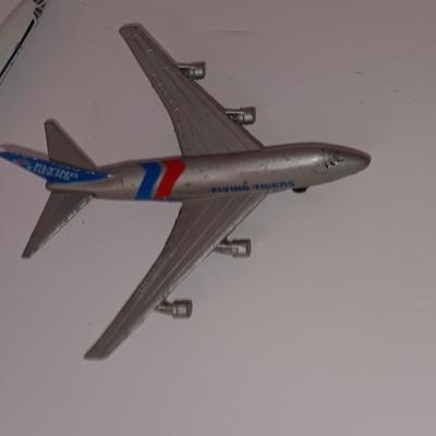 Three vintage metal airplanes and one British airlines model