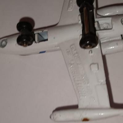 Three vintage metal airplanes and one British airlines model