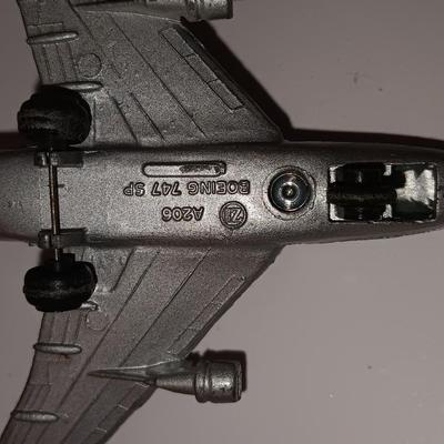 Three vintage metal airplanes and one British airlines model