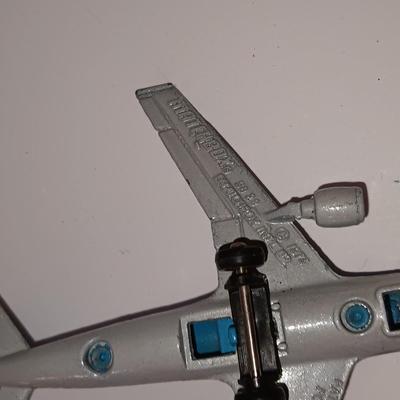 Three vintage metal airplanes and one British airlines model