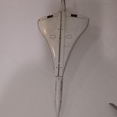Three vintage metal airplanes and one British airlines model