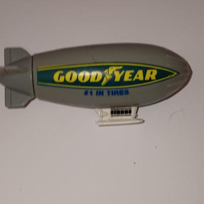 Three vintage die cast planes and a plastic Blimp
