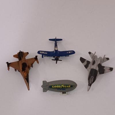 Three vintage die cast planes and a plastic Blimp