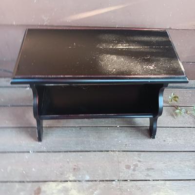 Small black two tiered shelf