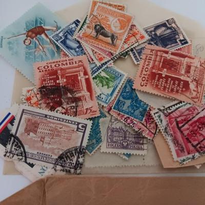 The Stamp book with stamps - and extra loose stamps too Postage stamp collection