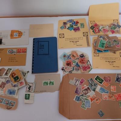 The Stamp book with stamps - and extra loose stamps too Postage stamp collection