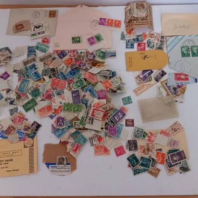 Who spilled the stamps?! Postage stamps galore! Stamp collecting