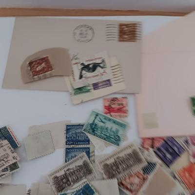 Who spilled the stamps?! Postage stamps galore! Stamp collecting