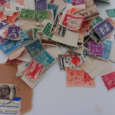 Who spilled the stamps?! Postage stamps galore! Stamp collecting