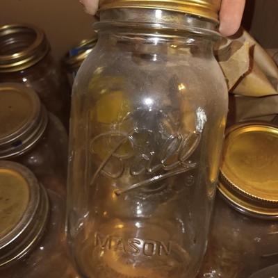 Canning Jars with assortment of lids and other items