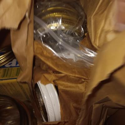 Canning Jars with assortment of lids and other items
