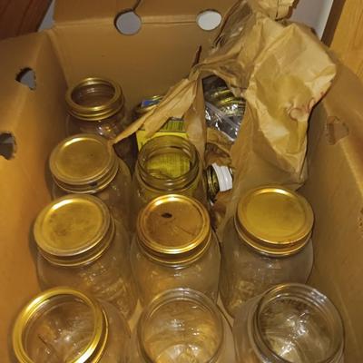 Canning Jars with assortment of lids and other items