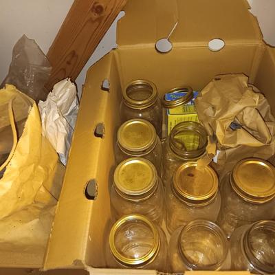 Canning Jars with assortment of lids and other items