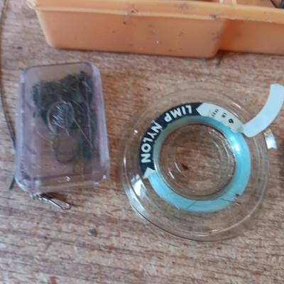 Fishing lures with green canvas military bag