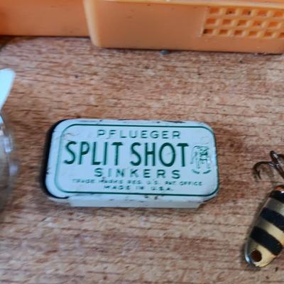 Fishing lures with green canvas military bag