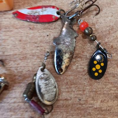 Fishing lures with green canvas military bag