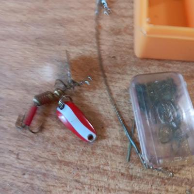 Fishing lures with green canvas military bag