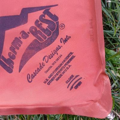 Two Therma-a- rest chairs and a Rockies stadium seat