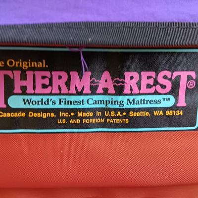 Two Therma-a- rest chairs and a Rockies stadium seat