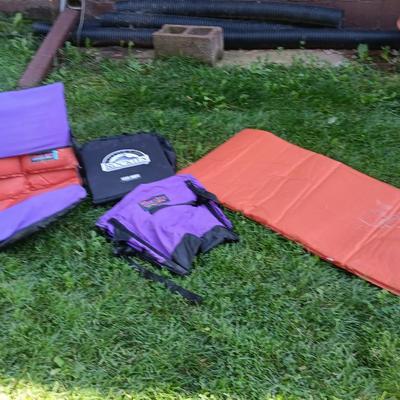 Two Therma-a- rest chairs and a Rockies stadium seat