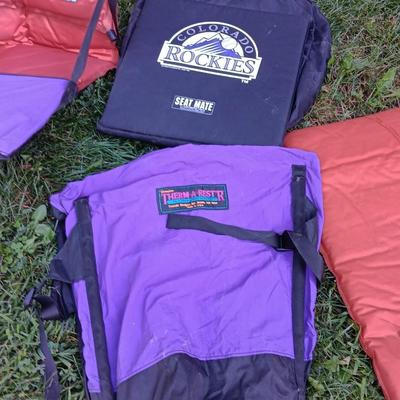 Two Therma-a- rest chairs and a Rockies stadium seat