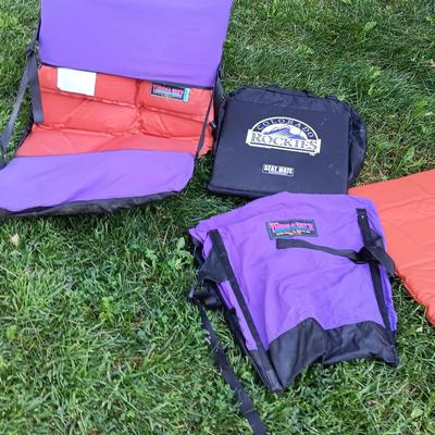 Two Therma-a- rest chairs and a Rockies stadium seat