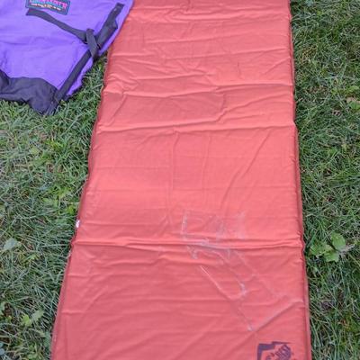 Two Therma-a- rest chairs and a Rockies stadium seat