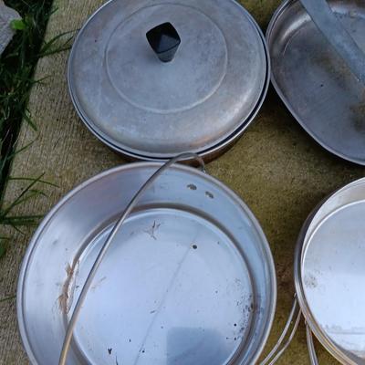 Camping pots, pans, and set of pans in nylon bag