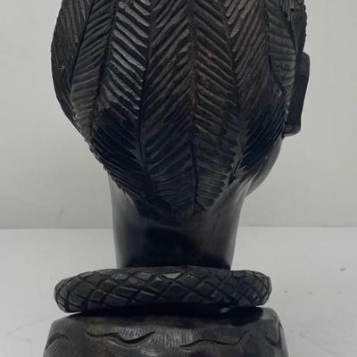 Female statue with up turned hair