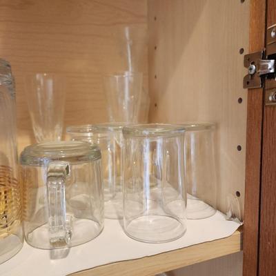 Kitchen Cabinet of Glasses , Bowls, Coke Coca Cola Glasses