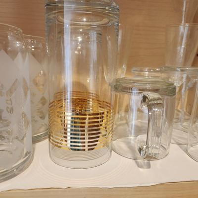 Kitchen Cabinet of Glasses , Bowls, Coke Coca Cola Glasses
