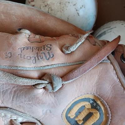 Baseballs and Softballs with bats and tall crate perfect to hold your bats!