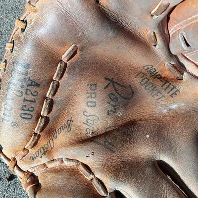 Louisville Slugger I25J Wooden baseball bat with Wilson glove and a ball