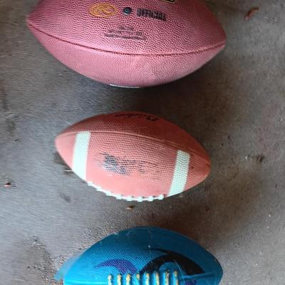 Three Footballs
