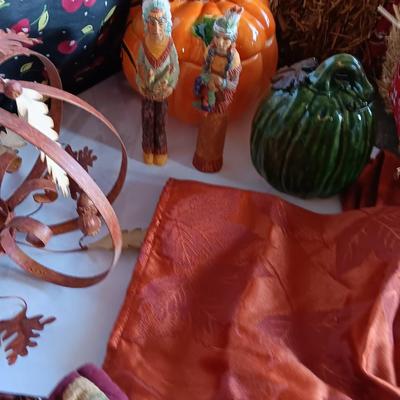 Fall Decorations for your home - pumpkins - scarecrow - tablecloth- miniature straw bales.