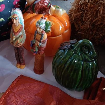 Fall Decorations for your home - pumpkins - scarecrow - tablecloth- miniature straw bales.