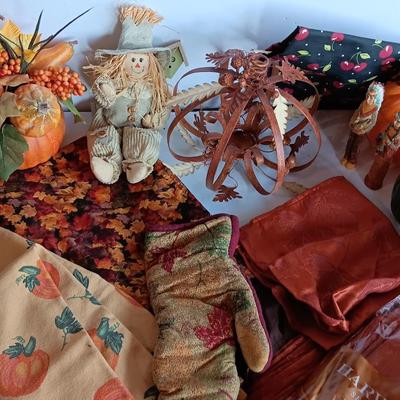 Fall Decorations for your home - pumpkins - scarecrow - tablecloth- miniature straw bales.