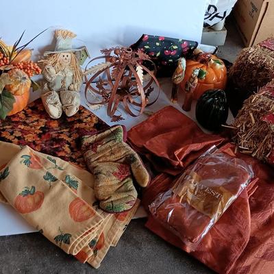Fall Decorations for your home - pumpkins - scarecrow - tablecloth- miniature straw bales.