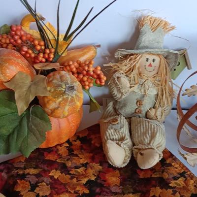 Fall Decorations for your home - pumpkins - scarecrow - tablecloth- miniature straw bales.