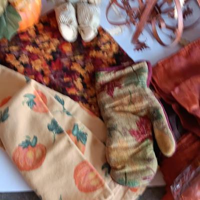 Fall Decorations for your home - pumpkins - scarecrow - tablecloth- miniature straw bales.