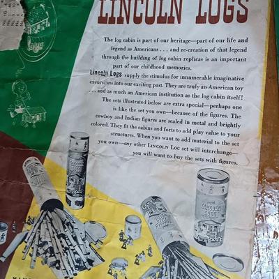 Vintage Lincoln logs in a wooden box with instructions