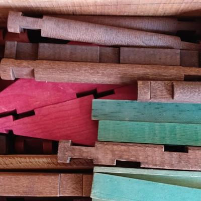 Vintage Lincoln logs in a wooden box with instructions