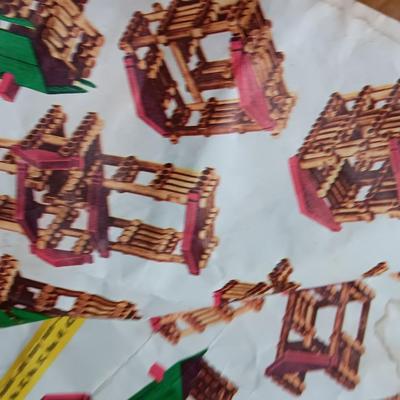 Vintage Lincoln logs in a wooden box with instructions
