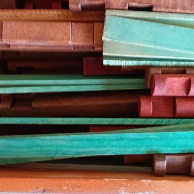 Vintage Lincoln logs in a wooden box with instructions