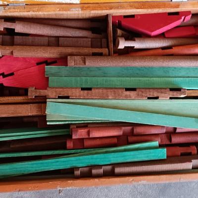 Vintage Lincoln logs in a wooden box with instructions
