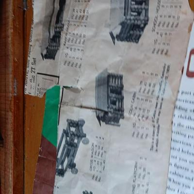 Vintage Lincoln logs in a wooden box with instructions