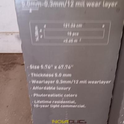 Two boxes of flooring oca acre Luxury floor plank with nova click