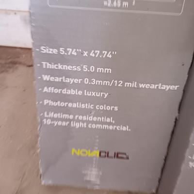 Two boxes of flooring oca acre Luxury floor plank with nova click