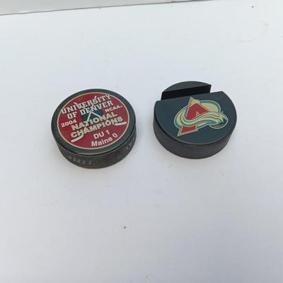 Colorado Avalanche hockey puck and University of Denver 2004 NCAA National Champs puck