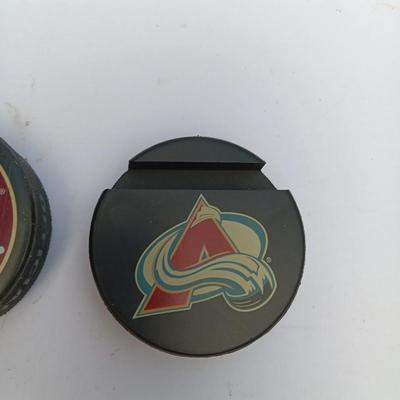 Colorado Avalanche hockey puck and University of Denver 2004 NCAA National Champs puck